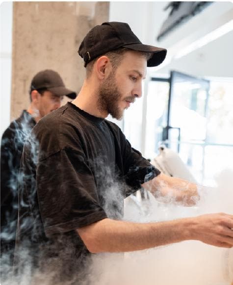 Four Winters chef making ice cream in a cloud of mist